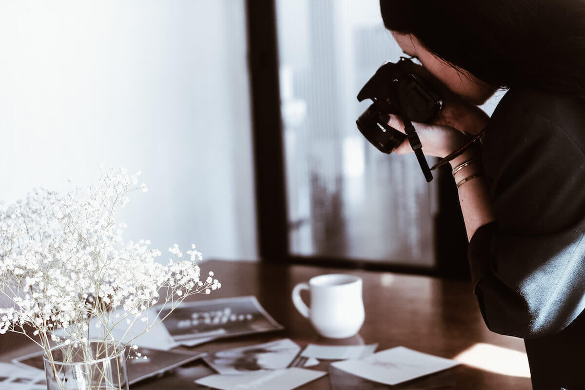 woman photographer at design table