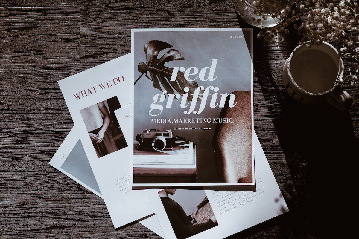 Red Griffin rebrand design spread on table